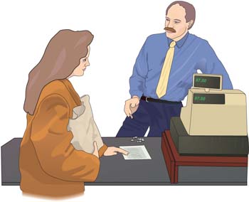 Woman paying bill in supermarket